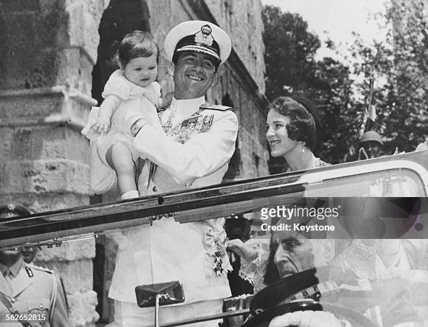 King Constantine of Greece with his wife Queen Anne Marie and baby daughter Princess Alexia, in an open car driving to Te Deum at Naufplio, May 24th...