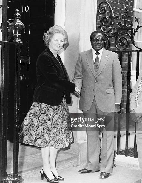 British Prime Minister Margaret Thatcher shaking hands with Zimbabwe Prime Minister Robert Mugabe outside 10 Downing Street, London, May 9th 1980.