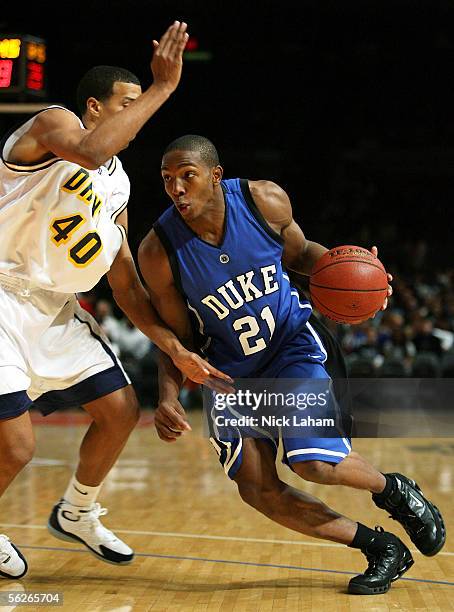 DeMarcus Nelson of the Duke Blue Devils drives to the hoop around Kenny Tribbett of the Drexel Dragons during their Preseason NIT game at Madison...