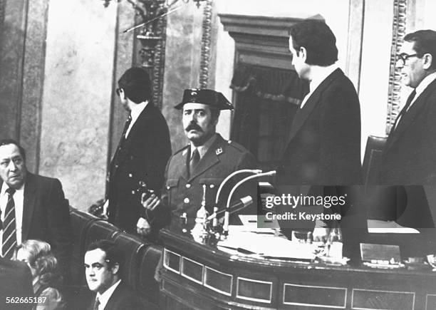 Colonel Antonio Tejero brandishing a gun as he attempts to take over Spanish parliament in a coup with the Guardia Civil, February 1981.