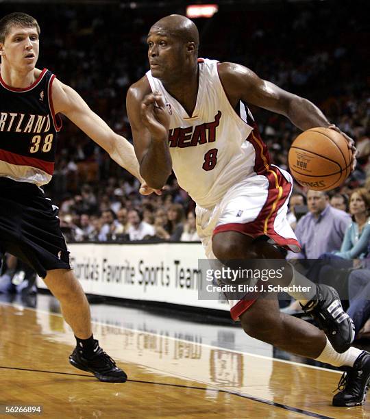 Forward Antoine Walker of the Miami Heat drives to the basket against forward Viktor Khryapa of the Portland Trail Blazers on November 23, 2005 at...