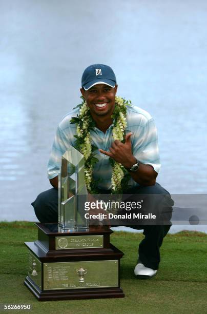 Tiger Woods poses with the winner's trophy after his victory in the 23rd PGA Grand Slam of Golf on November 23, 2005 at Poipu Bay Golf Course in...