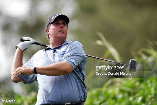 Phil Mickelson lets go of his club after hitting out of bounds on the 10th hole during the final round of the 23rd PGA Grand Slam of Golf on November...