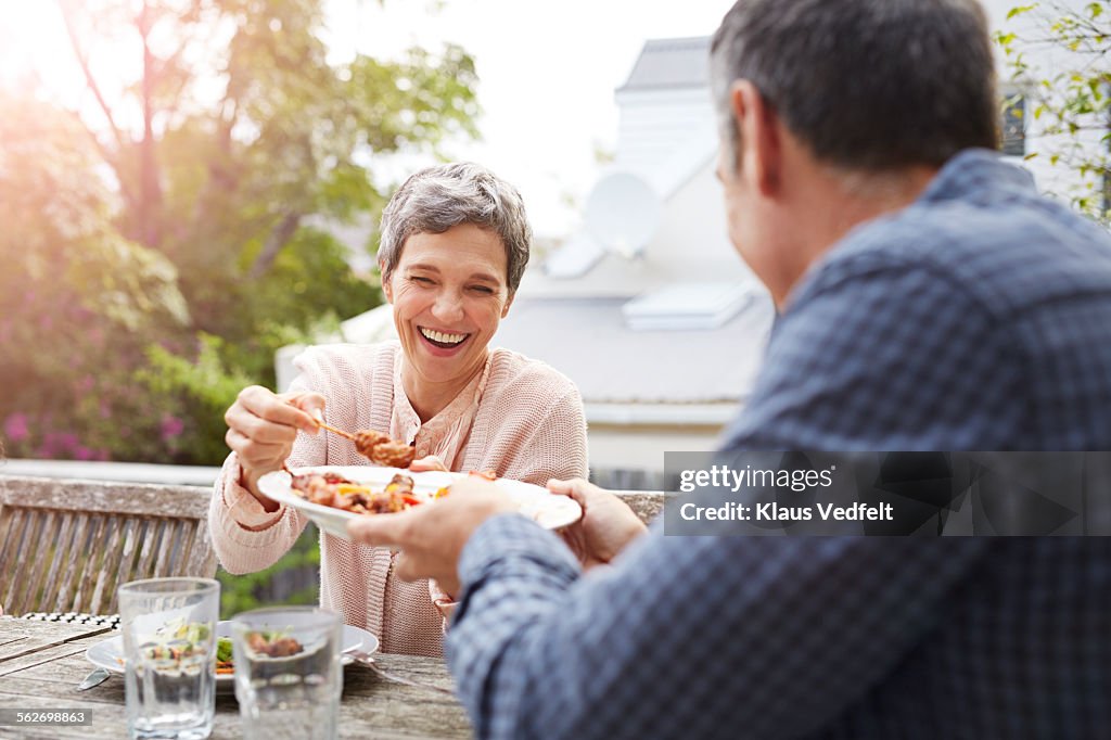 Mature couple having dinner outside