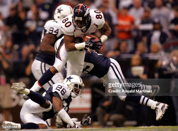 Wide receiver Rod Smith of the Denver Broncos makes a pass reception against Aaron Glenn of the Dallas Cowboys on November 24, 2005 at Texas Stadium...