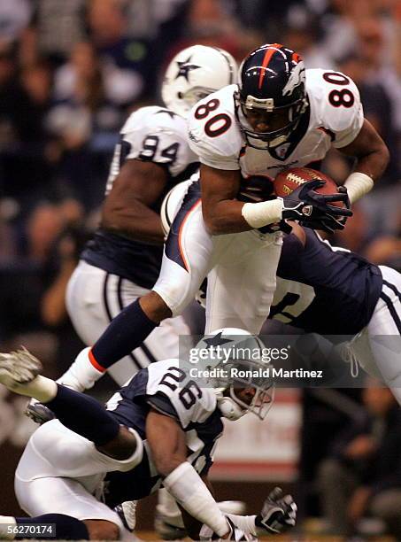 Wide receiver Rod Smith of the Denver Broncos makes a pass reception against Aaron Glenn of the Dallas Cowboys on November 24, 2005 at Texas Stadium...