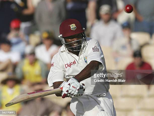Brian Lara of the West Indies hits a four to bring up his double century during day one of the Third Test between Australia and the West Indies...