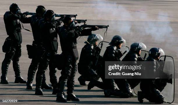 Chinese police take part in a special training program at Xihongmen Base of Police Patrol Brigade on November 25, 2005 in Beijing, China. The special...