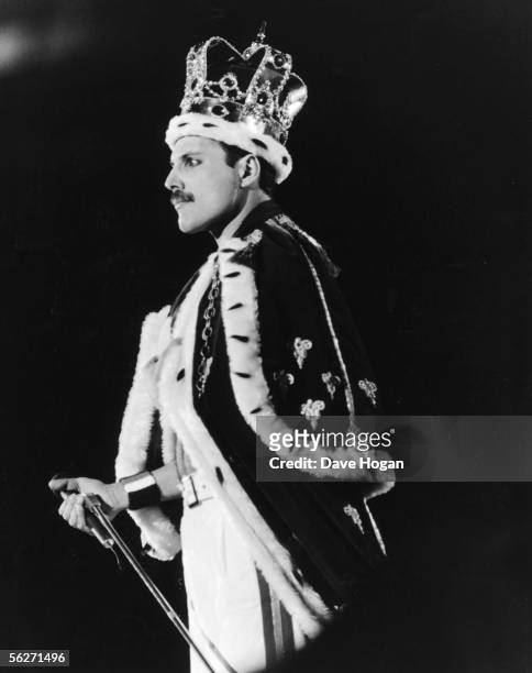 Singer Freddie Mercury dressed as a King during a performance with his group Queen at Wembley Stadium in London, 15th July 1986.
