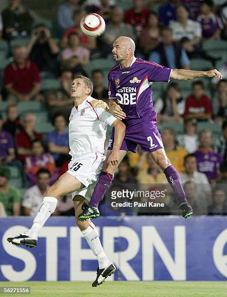Vaughan Coveny for the Jets contests the ball in front of Matt Horsley for the Glory during the round 14 A-League match between the Perth Glory and...