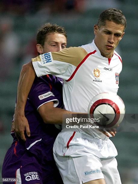 Vaughan Coveny for the Jets traps the ball in front of Jamie Coyne for the Glory during the round 14 A-League match between the Perth Glory and the...