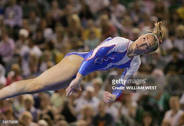 Emilie Le Pennec of France sails through the air on the floor routine as she takes out 5th place in the Women's Individual All-Round Final at the...