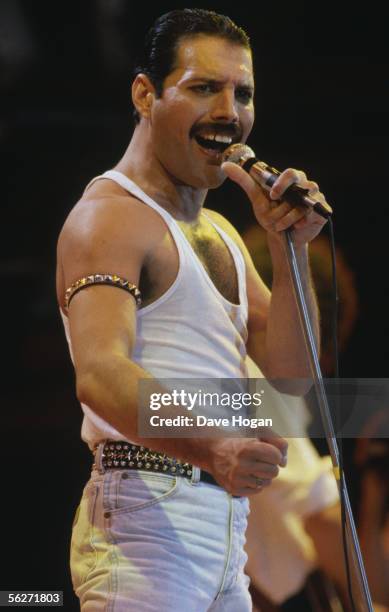 Singer Freddie Mercury of Queen performs during Live Aid at Wembley Stadium on 13 July 1985.