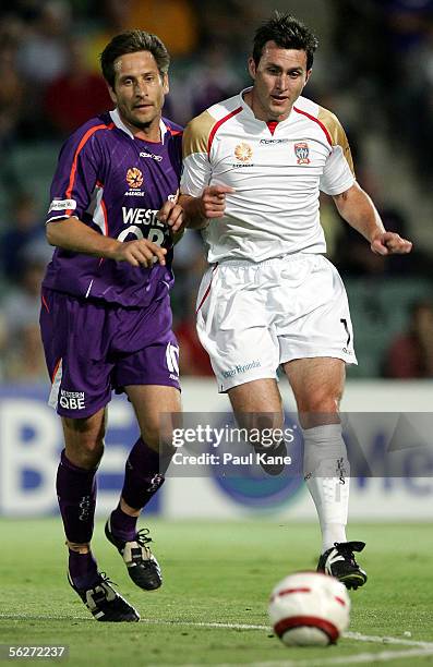 Bobby Despotovski for the Glory and Richard Johnson for the Jets contest the ball during the round 14 A-League match between the Perth Glory and the...