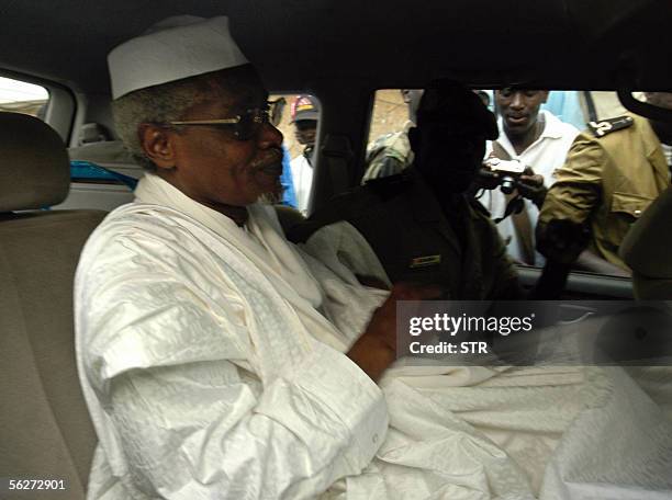 Chad's ex-dictator Hissene Habre leaves Dakar's courthouse escorted by prison guards 25 November 2005. A Senegal court 25 November disqualified...