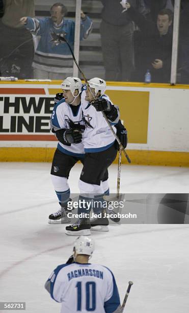 Patrick Marleau and Marco Sturm of the San Jose Sharks celebrate Marleau's goal against the Phoenix Coyotes during game one of their first round...