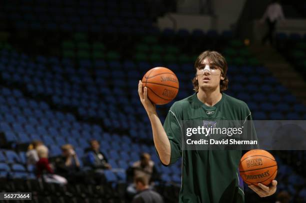 Andrew Bogut of the Milwaukee Bucks warms up prior to the game against the Minnesota Timberwolves wearing a protective mask after receiving surgery...