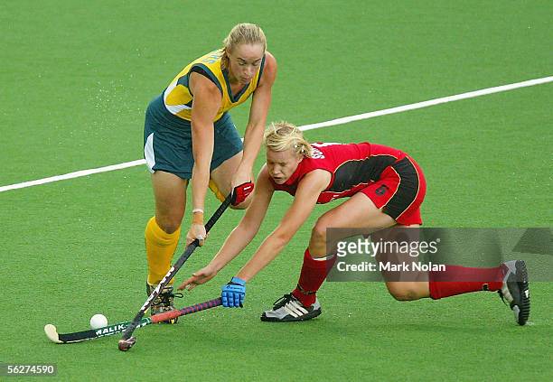 Megan Rivers of Australia and Svenja Schuermann of Germany in action during the Women's Hockey Champions Trophy first round match between Australia...