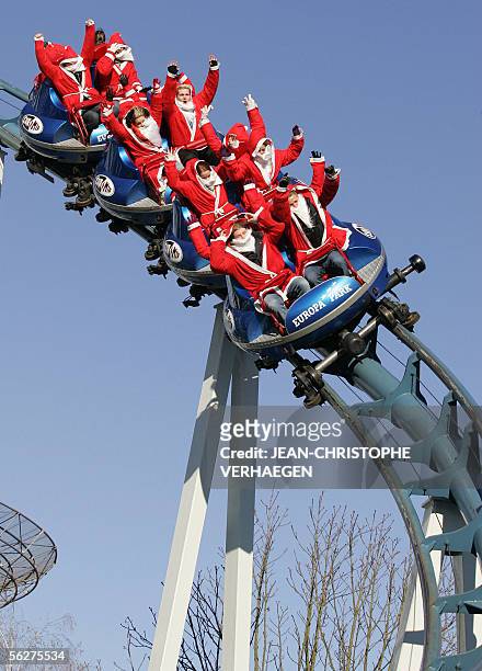 People dressed as Santa Claus ride a roller coaster, 26 November 2005 at Rust's Europark. Free entrance was offered to visitors dressed as father...