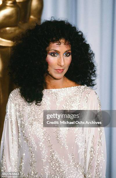 Singer Cher poses backstage during the 55th Academy Awards at Dorothy Chandler Pavilion, Los Angeles, California.