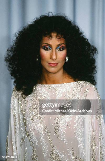 Singer Cher poses backstage during the 55th Academy Awards at Dorothy Chandler Pavilion, Los Angeles, California.