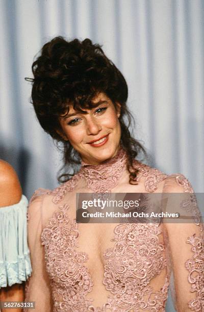 Actress Debra Winger poses backstage during the 54th Academy Awards at Dorothy Chandler Pavilion in Los Angeles,California.
