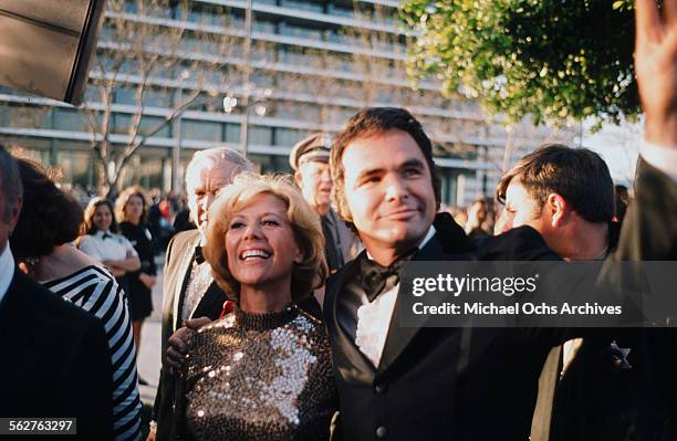 Entertainer Dinah Shore and actor Burt Reynolds arrive to the 46th Academy Awards at Dorothy Chandler Pavilion in Los Angeles,California.