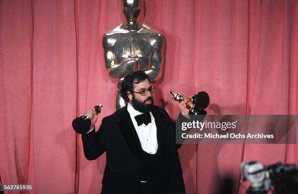 Director Francis Ford Coppola pose backstage with his Oscar after winning "Best Director" and "Best Picture" award during the 47th Academy Awards at...