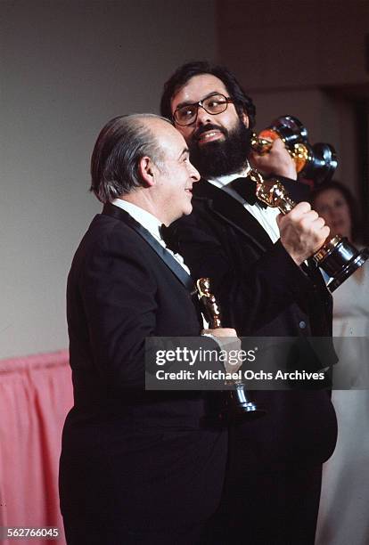 Director Francis Ford Coppola with his father Carmine pose backstage with his Oscar after winning "Best Director" and "Best Picture" award during the...