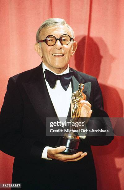 Actor George Burns poses backstage after winning " Best Supporting Actor" award during the 48th Academy Awards at Dorothy Chandler Pavilion in Los...