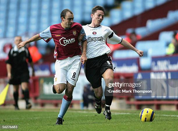 Gavin McCann of Aston Villa tangles with Matt Holland of Charlton during the Barclays Premiership match between Aston Villa and Charlton Athletic on...