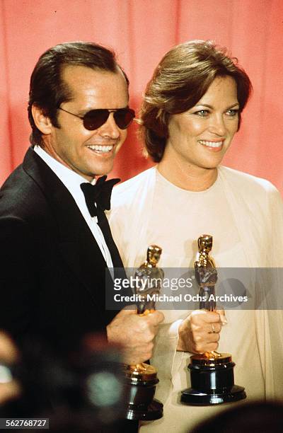 Actor Jack Nicholson with actress Louise Fletcher pose backstage after winning "Best Actor" and "Best Actress" for "One Flew Over the Cuckoo's Nest"...