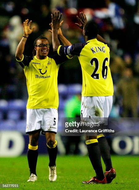 Edgar Davids and Ledley King of Spurs celebrate an away win during the Barclays Premiership match between Wigan Athletic and Tottenham Hotspur on...