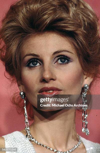 Actress Jill Ireland poses backstage after presenting " Best Supporting Actress" award during the 46th Academy Awards at Dorothy Chandler Pavilion in...