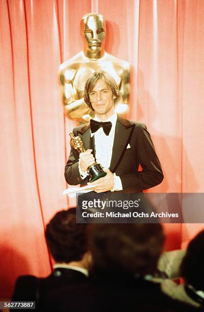 Actor Keith Carradine poses backstage after winning "Best Original Song" during the 48th Academy Awards at Dorothy Chandler Pavilion in Los...