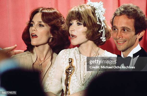 Actress Lee Grant poses backstage after winning " Best Supporting Actress" with Madeline Kahn and actor Joel Grey during the 48th Academy Awards at...