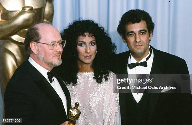 Singer Placido Domingo and Cher pose with Composer John Williams after winning "Best Original Score" during the 55th Academy Awards at Dorothy...