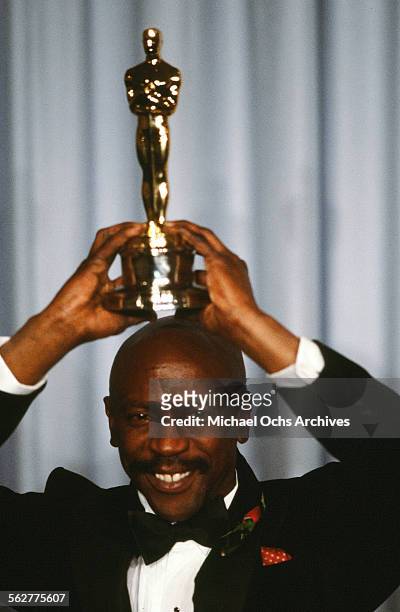 Actor Louis Gossett, Jr.pose backstage after he wins "Best Supporting Actor" award during the 55th Academy Awards at Dorothy Chandler Pavilion in Los...