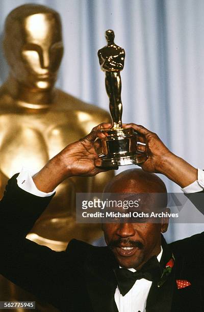 Actress Susan Sarandon and actor Louis Gossett, Jr.pose backstage after he wins "Best Supporting Actor" award during the 55th Academy Awards at...