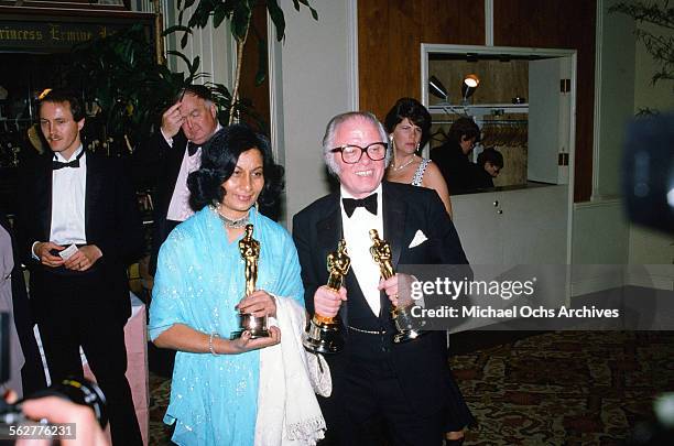 Director Richard Attenborough winner of "Best Director" poses with Bhanu Athaiya winner of "Best Costume Design" backstage during the 55th Academy...