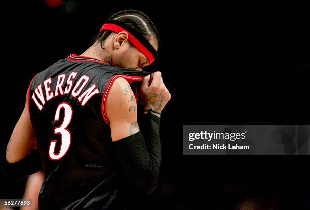Allen Iverson of the Philadelphia 76ers wipes sweat from his face against the New York Knicks on November 26, 2005 at Madison Square Garden in New...