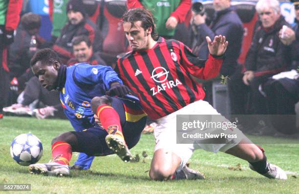 Souleymane Diamoutene of Lecca and Alberto Gilardino of Milan tussle for the ball during the Serie A match between AC Milan and Lecce at the Giuseppe...