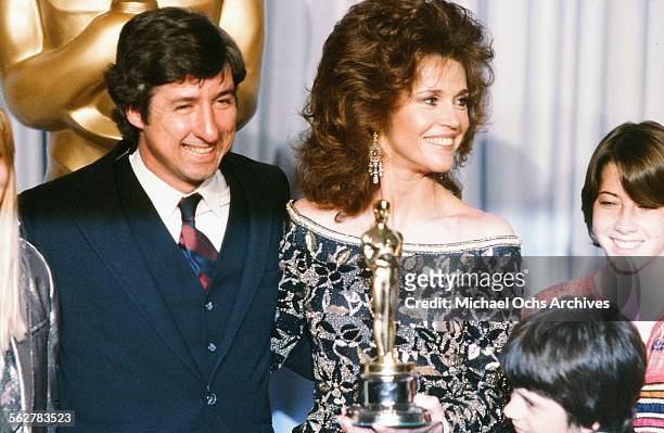 Actress Jane Fonda with husband Tom Hayden and family poses backstage after accepting her father Henry Fonda "Best Actor" award during the 54th...