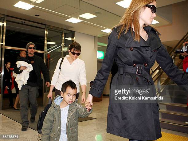 Actor Brad Pitt and actress Angelina Jolie arrive with Jolie's children Zahara Marley Jolie and Maddox Jolie at the New Tokyo International Airport...