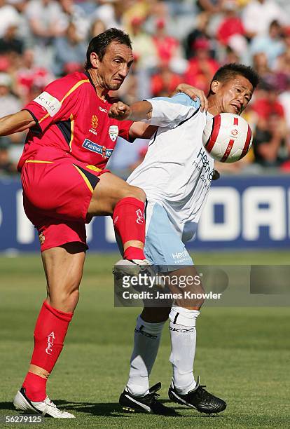 Michael Valkanis of United and Kazuyoshi Miura of Sydney in action during the round 14 A-League match between Adelaide United and Sydney FC at...