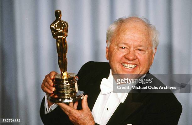 Actor Mickey Rooney poses backstage after receiving "Honorary Academy Award" during the 55th Academy Awards at Dorothy Chandler Pavilion, Los...