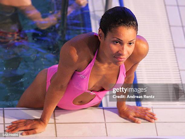 Television presenter Annabelle Mandeng looks on during the 3 meter Synchro Platform competition during the Stefan Raab 'TV Total Turmspringen' - TV...