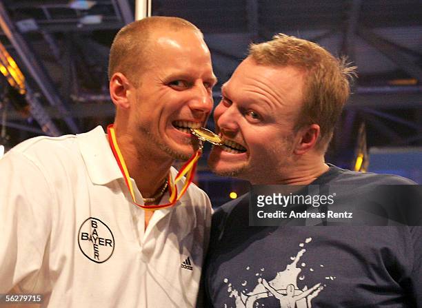 Athlete Lars Boergeling celebrates his win with television presenter Stefan Raab during the Stefan Raab 'TV Total Turmspringen' - TV Show at the...
