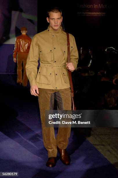 Models walk the runway at the "Fashion In Motion: Ozwald Boateng" catwalk show and 20th anniversary party at Victoria & Albert Museum on November 25,...