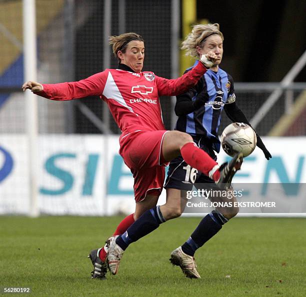 German Turbine Potsdam's Inken Becker struggles with Swedish Djurgarden/Alvsjo's Victoria Svensson during their UEFA Women's Cup semifinal match in...